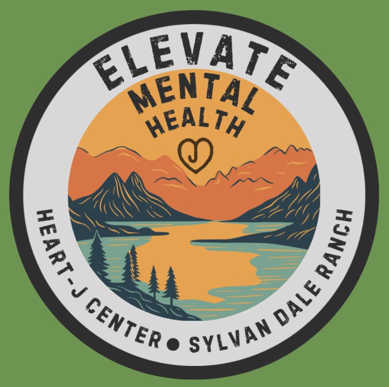 Circular logo with mountains, trees, and a lake at sunset. Text reads “Elevate Mental Health, Heart J Center, Sylvan Dale Ranch” with a heart icon in the center. Green background.